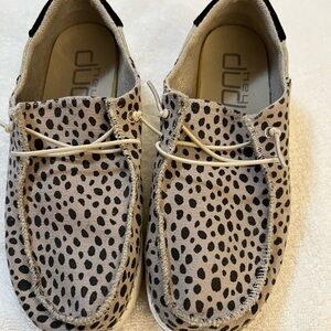Women’s cheetah Hey Dude loafers.